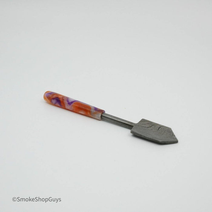 710 Dabbers Damascus Shovel – Premium Dab Tool for Concentrate Handling: Elegant Design, Features Damascus Steel Pattern, Unique Look, Precision Handling, Perfectly Shaped for Scooping, Applying Concentrates, Durable Build, High-Quality Material, Ensures Long-Lasting Performance, Ergonomic Grip, Designed for Comfort, Control During Sessions, Portable Size, Ideal for At-Home or On-the-Go Use.