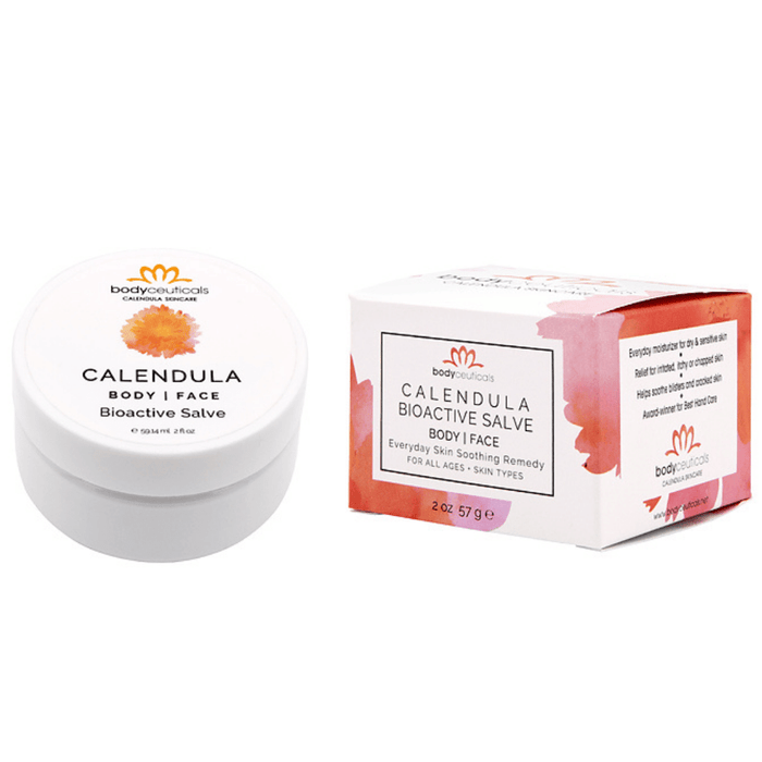 Jar of the organic calendula salve sitting next to it's box on a white background.