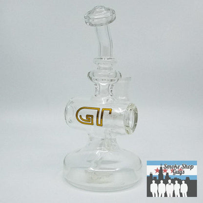 Glass Tribe Clear Small Eclipse Dab Rig - Compact and Functional Design: Elegant Clear Glass Design, Sleek and Minimalistic Look, Compact Build, Small and Portable, Perfect for On-the-Go Sessions, Efficient Filtration, Provides Smooth Hits with Advanced Airflow Engineering, Premium Borosilicate Glass, Ensures Durability and Thermal Resistance, Versatile Use, Compatible with Various Accessories for Concentrates and Dry Herbs.