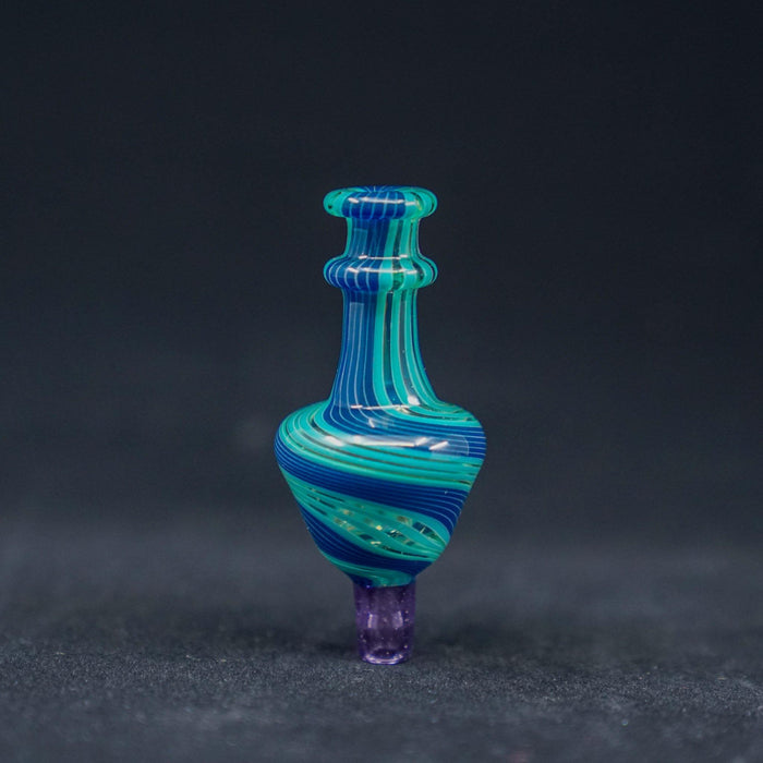 JWalkerGlass Linework Bubble Carb Cap - Artistic and Precise: Hand-blown by @JWalkerGlass, Intricate Linework, Color Accents, Compatible with 25mm and 30mm Bangers, Precise Airflow Control, Made from High-Quality Borosilicate Glass, Heat Resistance and Durability, Choose from Vibrant Color Combinations, Blue/Teal/Pink or Red/Gray/Yellow, Personalize Your Setup.