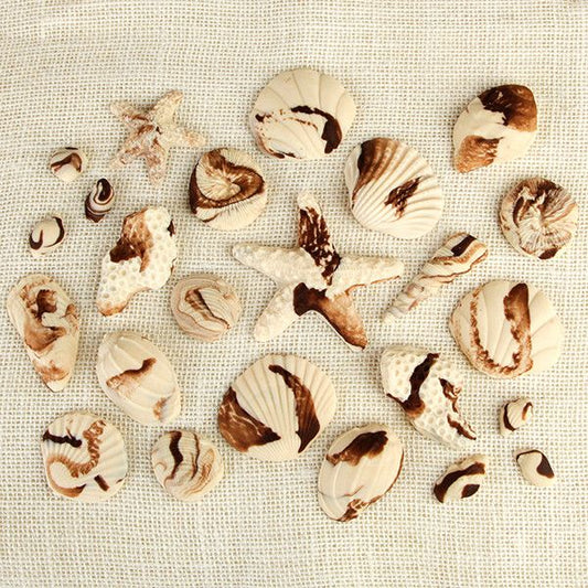 These fun edible fondant Marble Chocolate Sea Shells are perfect additions for any “Under the Sea” themed cakes.