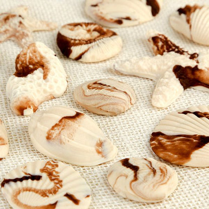 These fun edible fondant Marble Chocolate Sea Shells are perfect additions for any “Under the Sea” themed cakes.