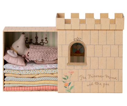 Maileg Princess and the Pea Big Sister Mouse — princess mouse doll resting atop a stack of colorful fabric mattresses inside the illustrated castle playset box, labeled 'The Princess Mouse and the Pea'