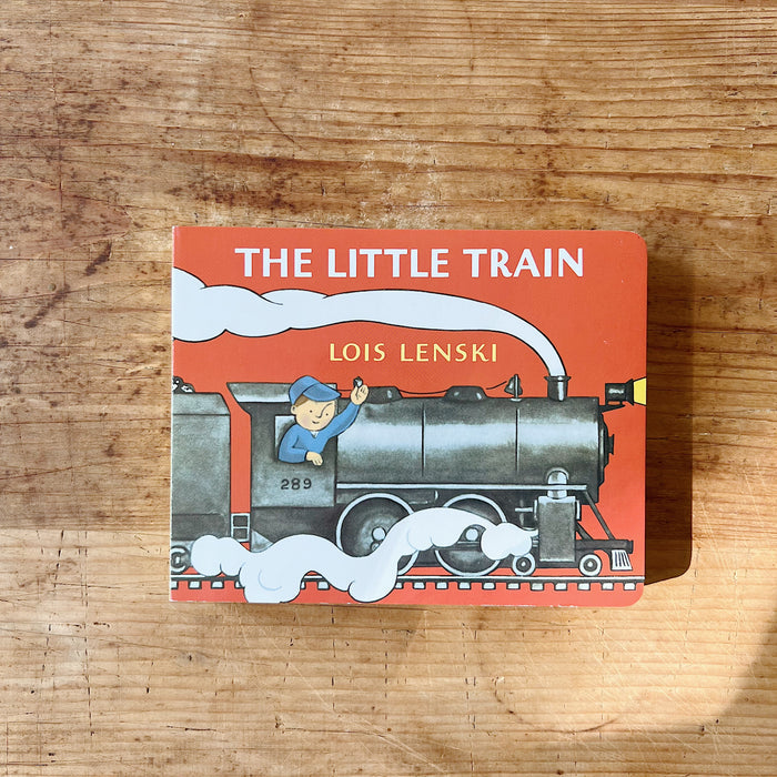 Cover of The Little Train by Lois Lenski, a red board book featuring an illustrated engineer waving from the cab of a large black steam locomotive numbered 289, with billowing white steam